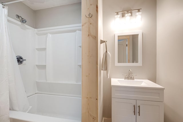 bathroom featuring shower / bath combo and vanity