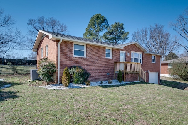 single story home with a garage, brick siding, fence, and a front lawn