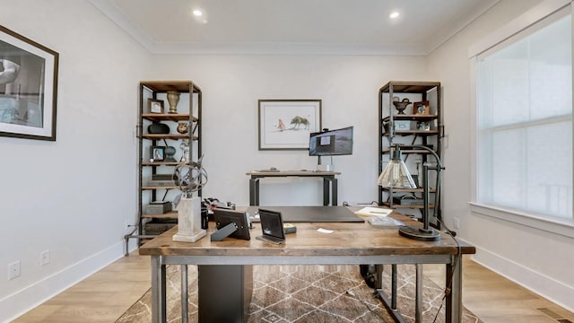 home office with ornamental molding, baseboards, and light wood finished floors