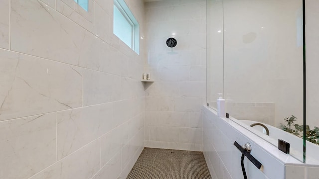 bathroom with tiled shower