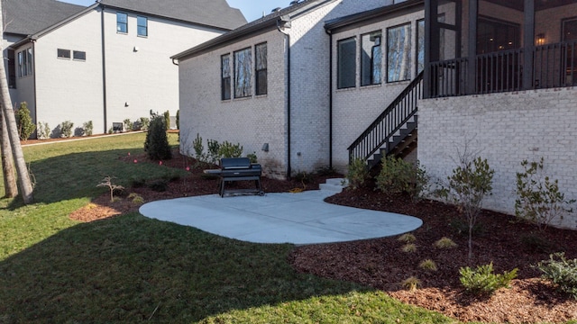 view of yard with stairs and a patio area