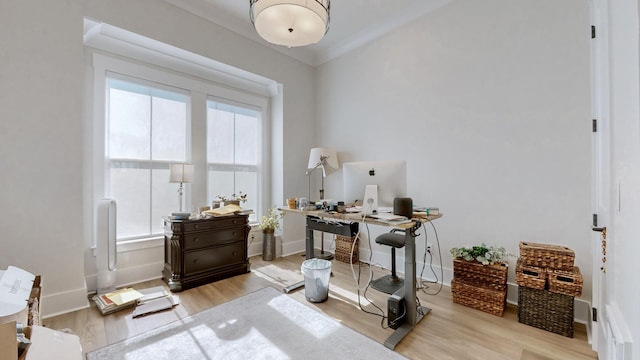 office with plenty of natural light, wood finished floors, and baseboards