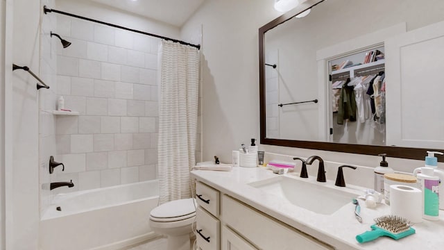 bathroom with shower / tub combo with curtain, vanity, and toilet