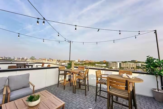 balcony featuring a view of city and a patio area