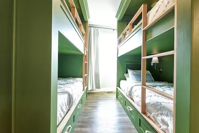 bedroom with wood finished floors