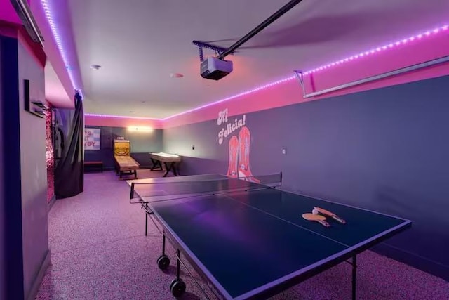 playroom featuring a garage and speckled floor