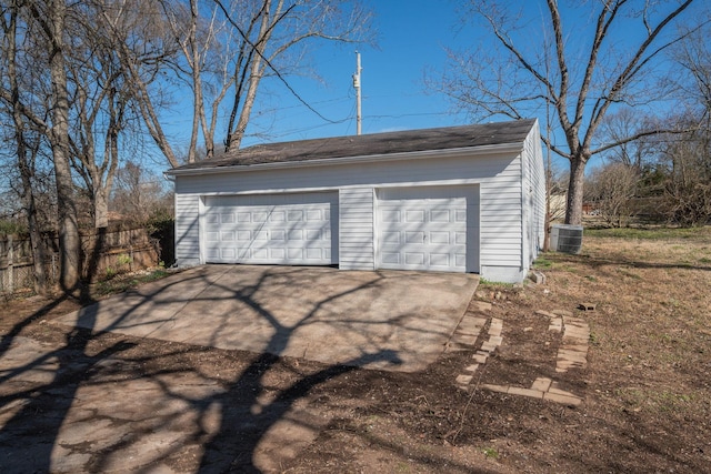 detached garage with cooling unit and fence