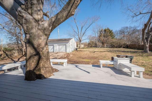 wooden deck with an outdoor structure and fence