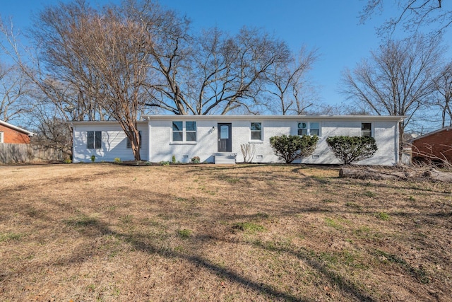 single story home featuring entry steps, a front lawn, crawl space, and brick siding