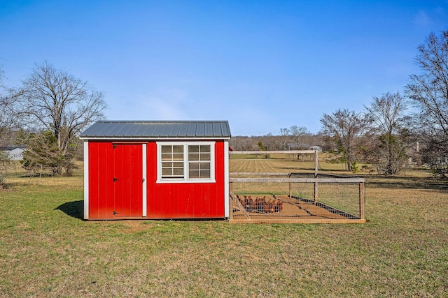 view of shed with a rural view