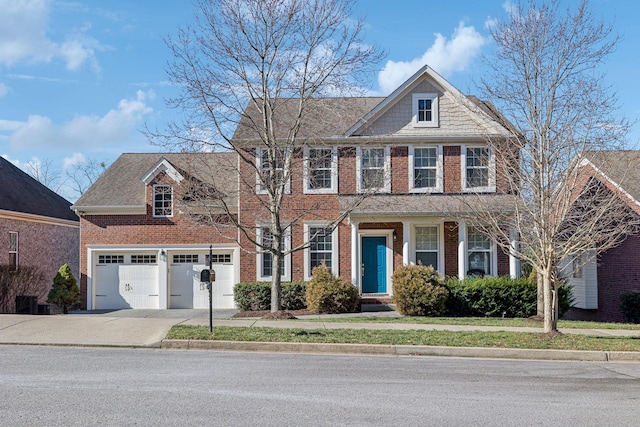 view of front of house with concrete driveway, brick siding, and an attached garage