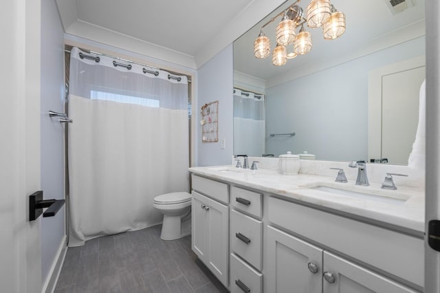 full bath featuring double vanity, a sink, visible vents, and crown molding