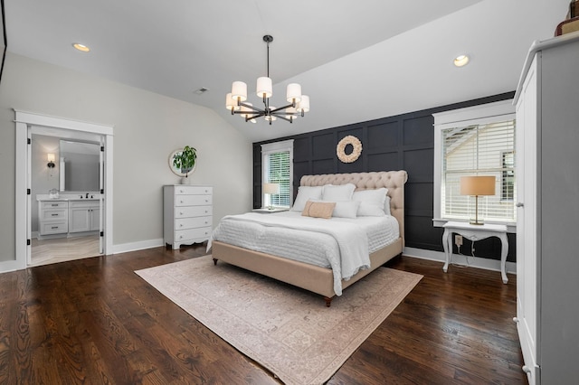 bedroom with lofted ceiling, multiple windows, dark wood finished floors, and an inviting chandelier