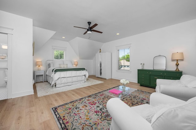 bedroom with light wood-type flooring, lofted ceiling, baseboards, and recessed lighting