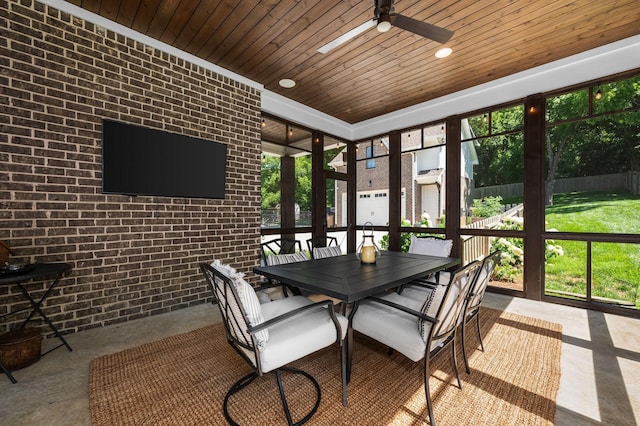 sunroom / solarium with wood ceiling and ceiling fan