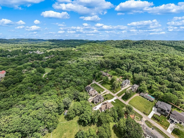 birds eye view of property with a forest view and a residential view