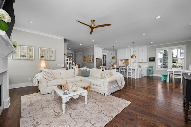 living area featuring a fireplace, baseboards, dark wood-style flooring, and recessed lighting