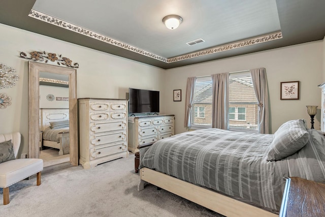 bedroom with light carpet and visible vents