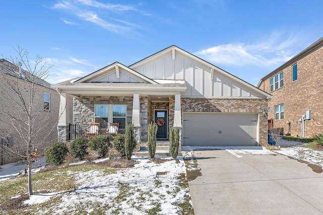 craftsman inspired home featuring an attached garage, covered porch, brick siding, concrete driveway, and board and batten siding