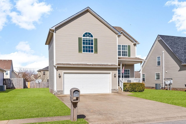 traditional home with concrete driveway, a front lawn, fence, and central air condition unit