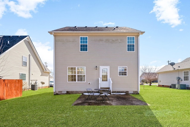 rear view of property with cooling unit, crawl space, a yard, and a patio