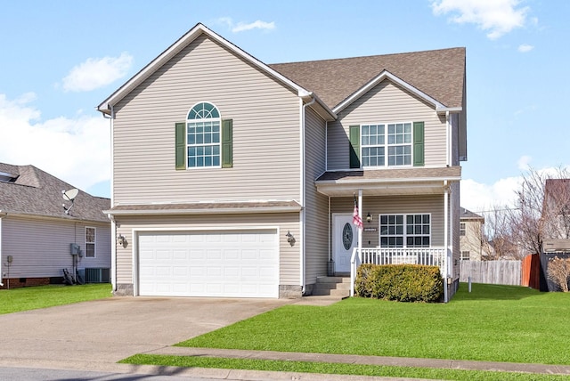 traditional-style house with a garage, driveway, covered porch, fence, and a front lawn