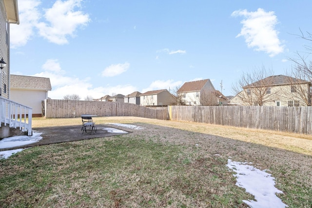 view of yard with a fenced backyard