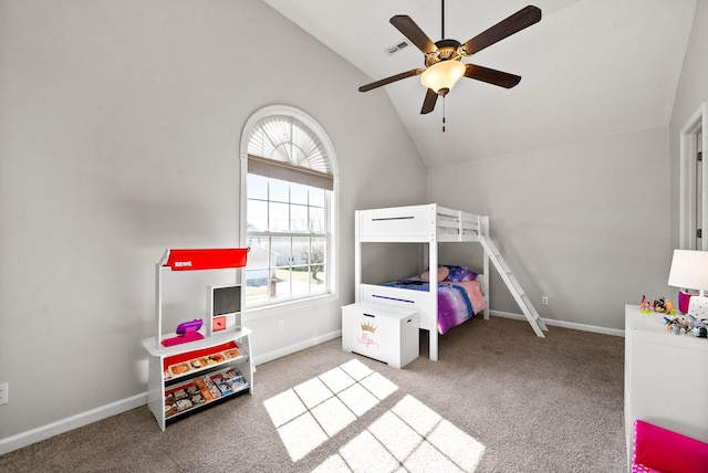 bedroom with baseboards, visible vents, ceiling fan, carpet floors, and high vaulted ceiling