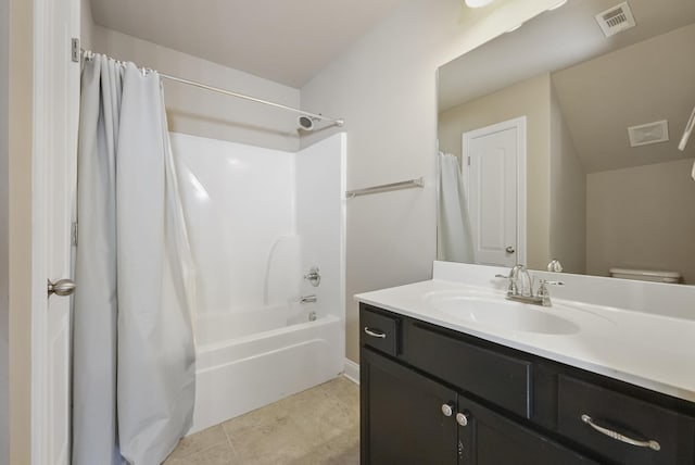 full bath with visible vents, shower / tub combo with curtain, vanity, and toilet