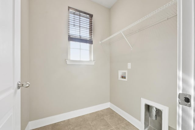 washroom with laundry area, light tile patterned flooring, hookup for a washing machine, and baseboards