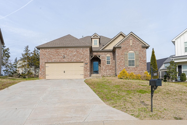 traditional-style house featuring driveway, brick siding, a shingled roof, and a front yard