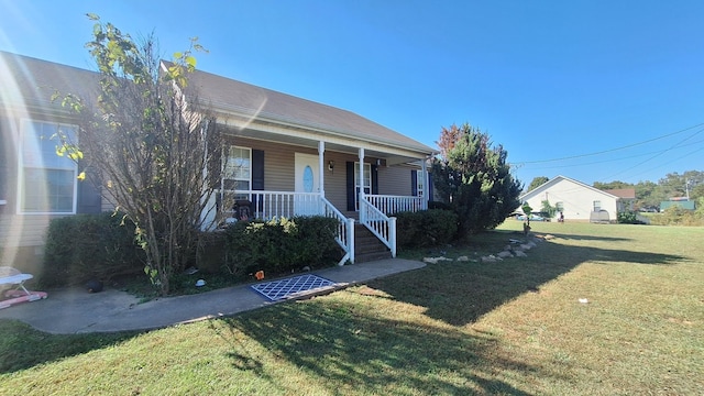 view of front of home featuring a porch and a front yard