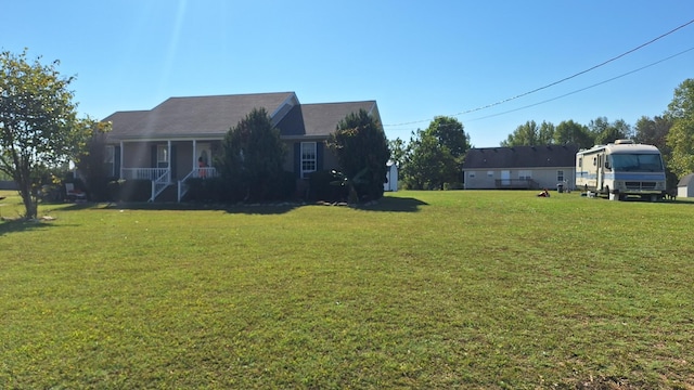 view of yard featuring covered porch