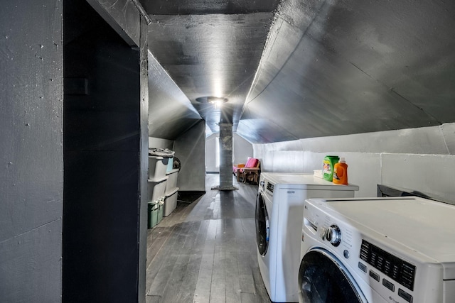 laundry area with washer and clothes dryer, laundry area, and hardwood / wood-style flooring