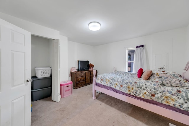 bedroom with light colored carpet