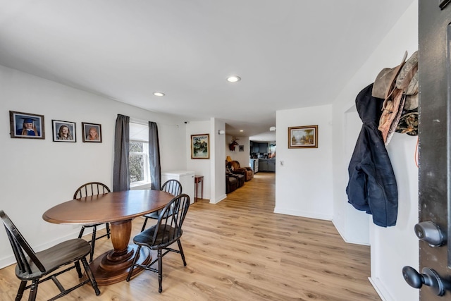 dining space featuring recessed lighting, baseboards, and light wood-type flooring