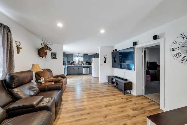 living area featuring recessed lighting and light wood-style floors