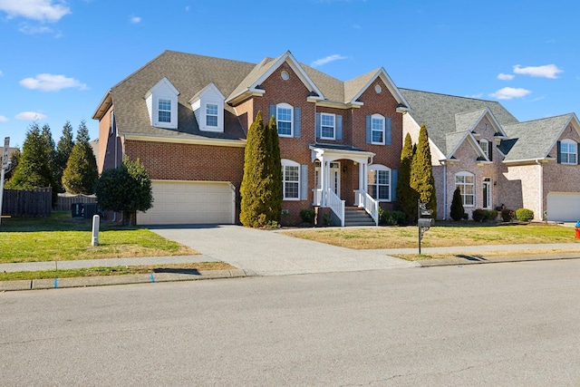 view of front of home with a garage, driveway, brick siding, and a shingled roof