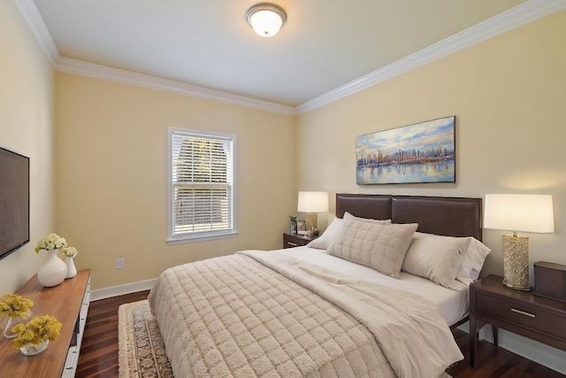 bedroom featuring baseboards, crown molding, and dark wood finished floors