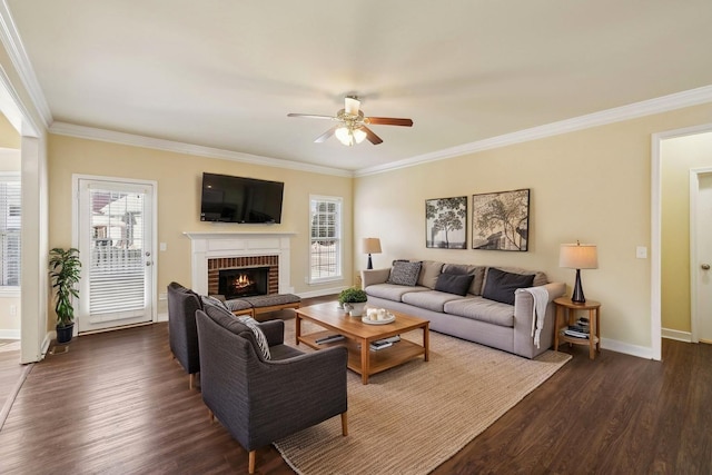 living room with a healthy amount of sunlight, a ceiling fan, and dark wood finished floors
