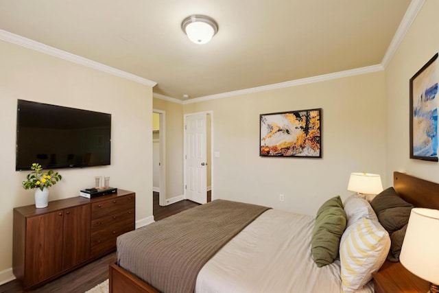 bedroom featuring dark wood-style flooring, baseboards, and ornamental molding