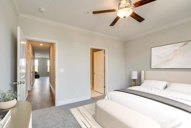 bedroom with baseboards, ornamental molding, a ceiling fan, and light colored carpet