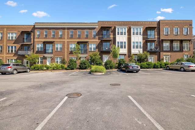 view of property with uncovered parking