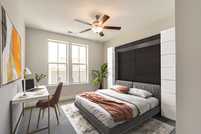 bedroom with baseboards, visible vents, ceiling fan, and carpet flooring