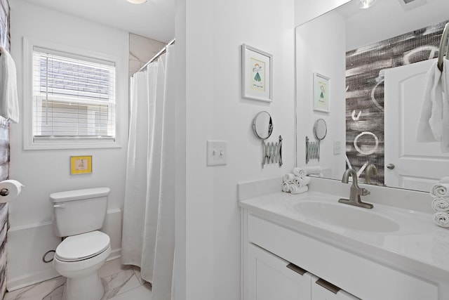 bathroom with marble finish floor, vanity, and toilet