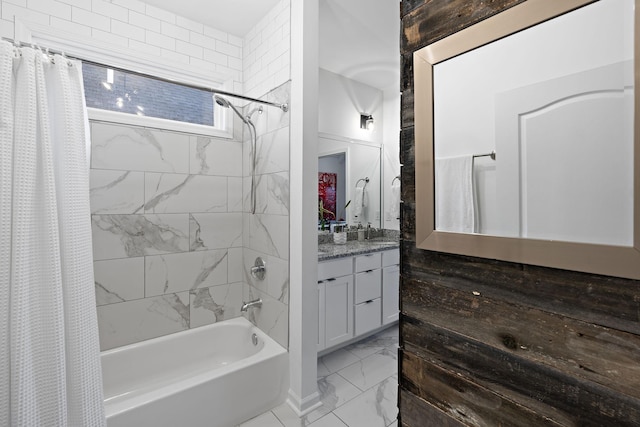 bathroom featuring marble finish floor, shower / tub combo, and vanity