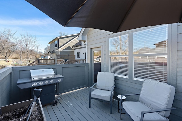 wooden deck featuring grilling area