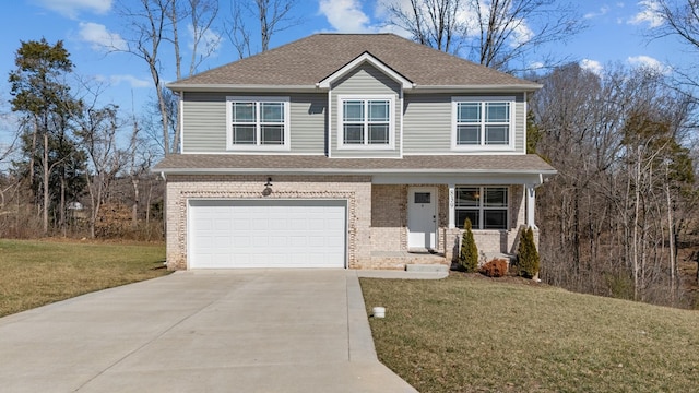 traditional home with driveway, brick siding, an attached garage, and a front yard