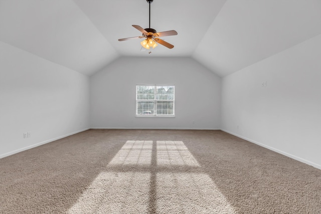 additional living space with a ceiling fan, vaulted ceiling, carpet floors, and baseboards