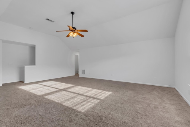 bonus room featuring lofted ceiling, ceiling fan, carpet floors, visible vents, and baseboards